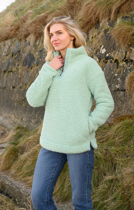 Lighthouse womens zip neck fleece in light green sherpa fabric worn outdoors