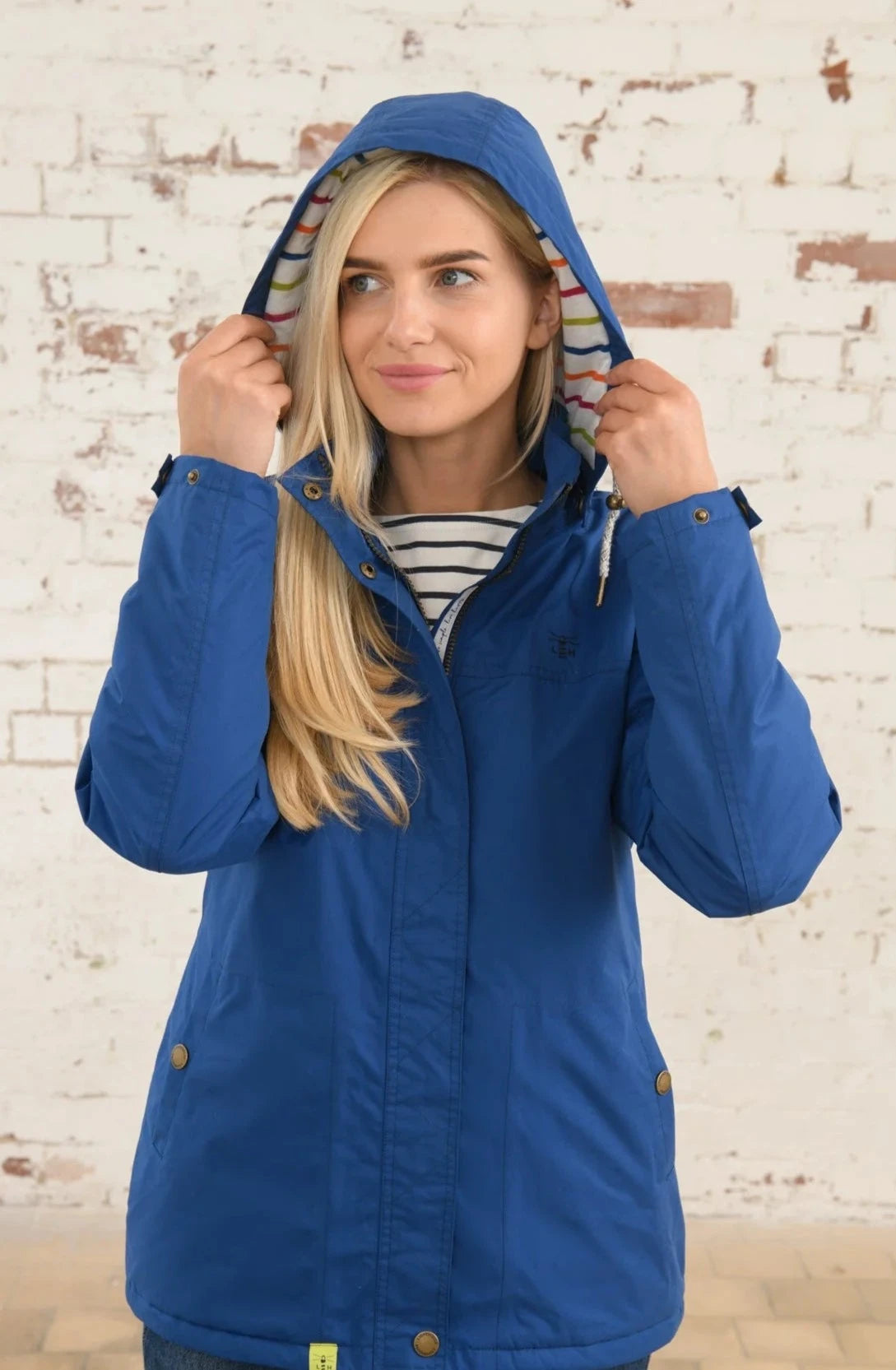 Women's hooded waterproof Eva rain coat from Lighthouse in Blue.