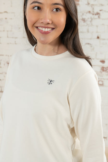 Plain women's crew neck sweatshirt from Lighthouse in Coconut with embroidered chest logo.