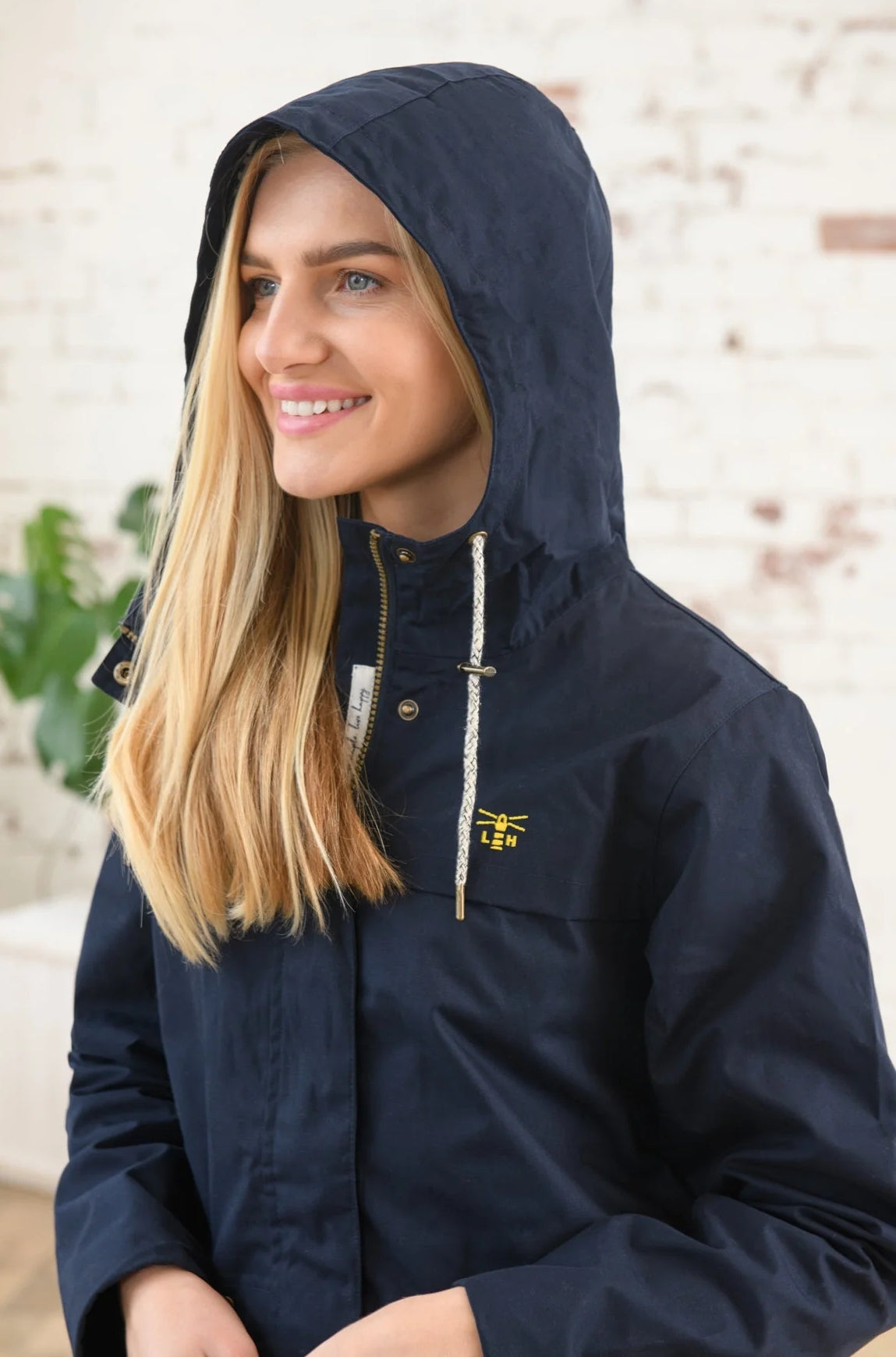 Lighthouse womens hooded Alicia waterproof rain jacket in navy.
