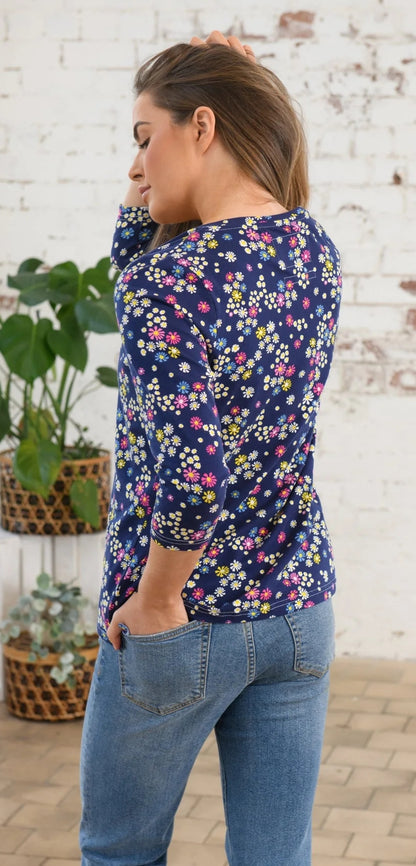 Women's Ariana Lighthouse 3/4 sleeve v-neck top in navy with a multicoloured floral print.