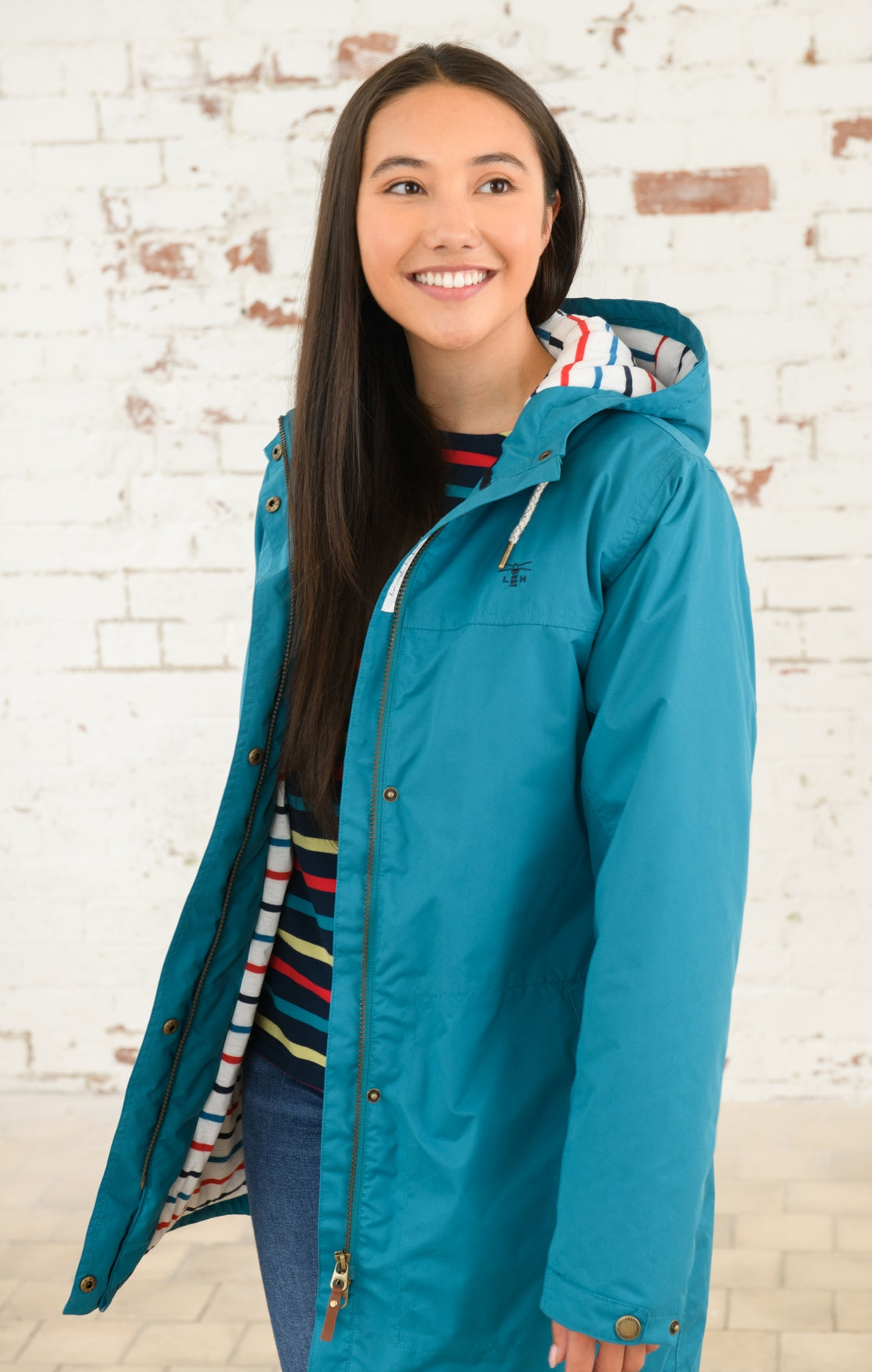 Women's padded waterproof Eva Long rain coat from Lighthouse in Peacock.