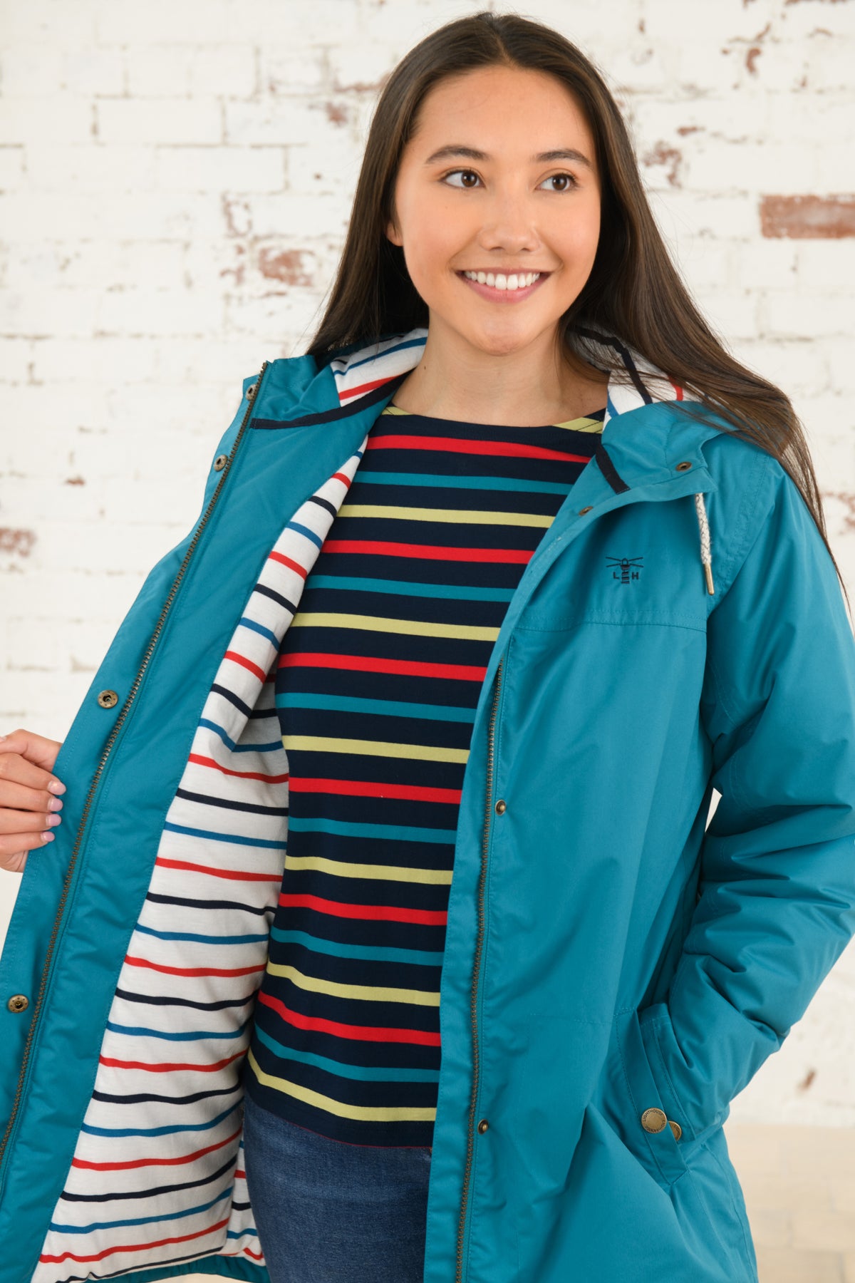 Lighthouse women's Peacock waterproof Eva Long padded coat with stripe lining.