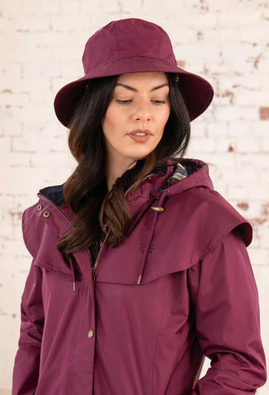Adults waterproof Storm rain hat from Lighthouse in Plum Purple.