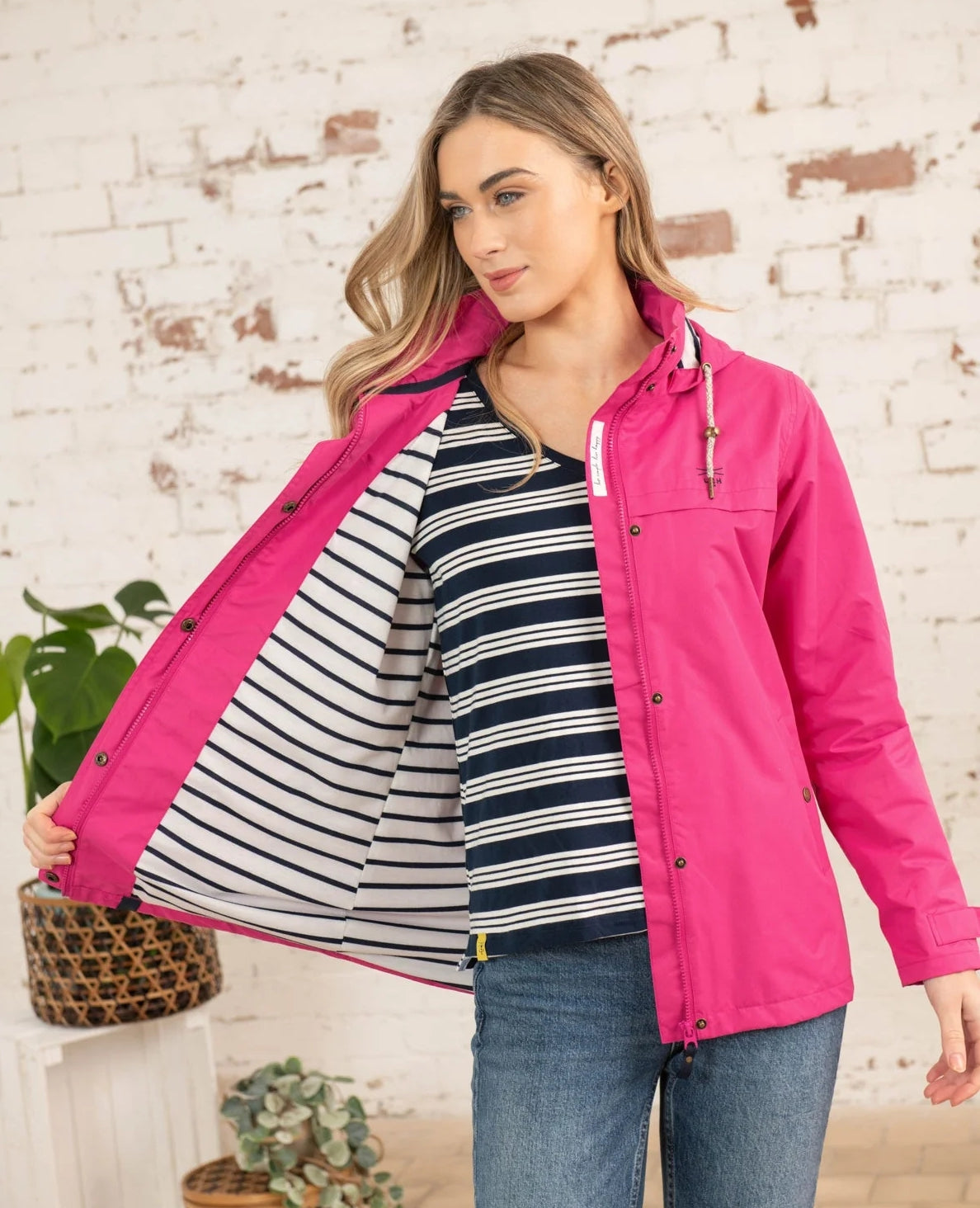Lighthouse women's Beachcomber waterproof jacket in pink with a stripe lining.