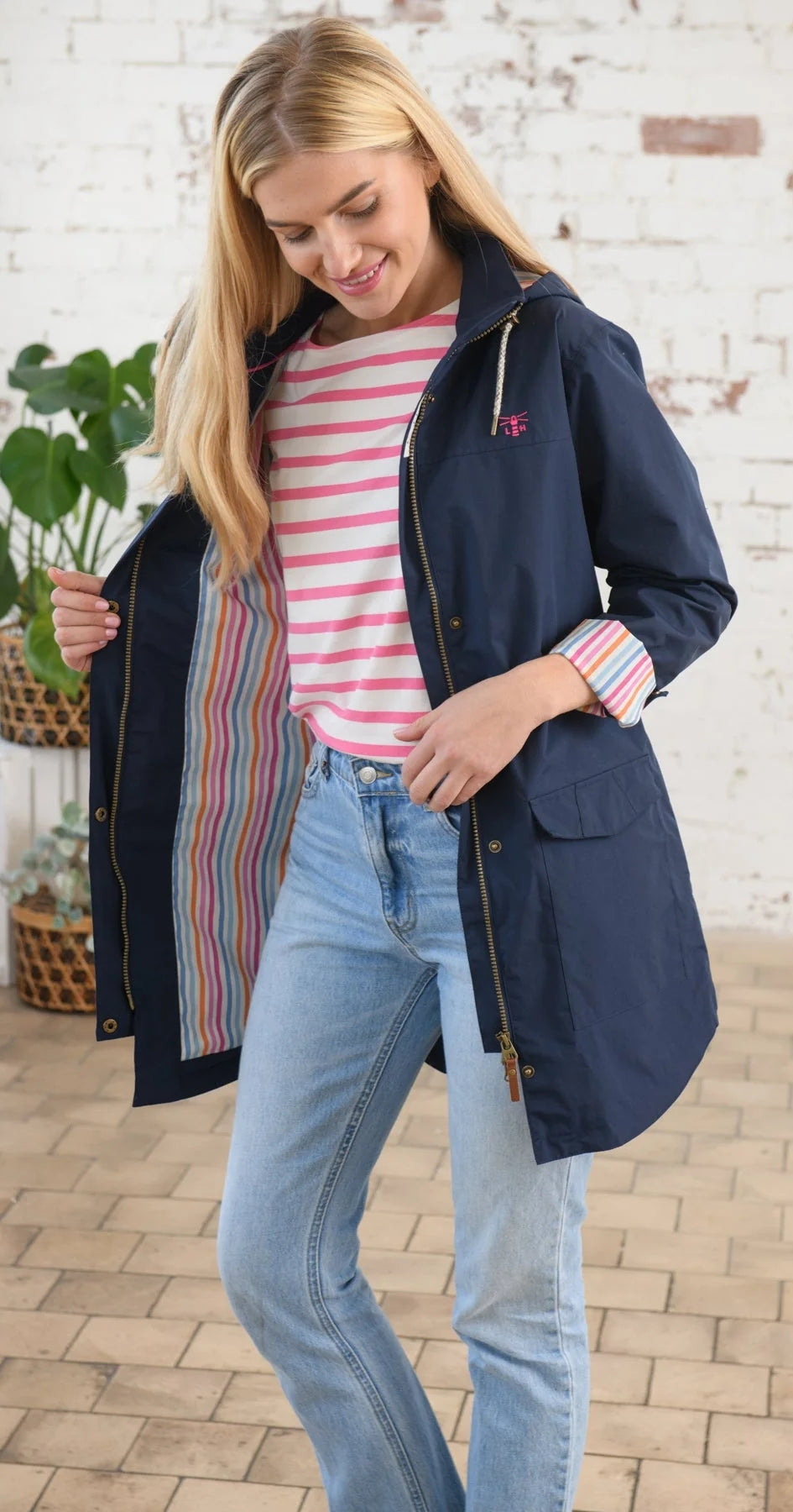 Lighthouse women's Rebecca waterproof jacket in Navy with multicoloured stripe lining.