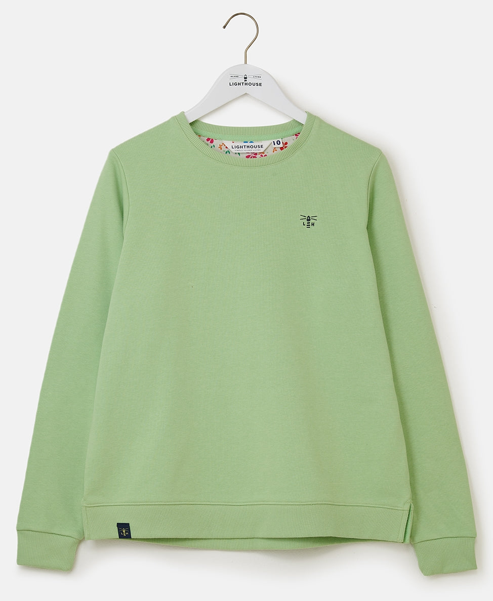 Lighthouse women's Seaside plain crew neck sweatshirt in Soft Green with floral lining.