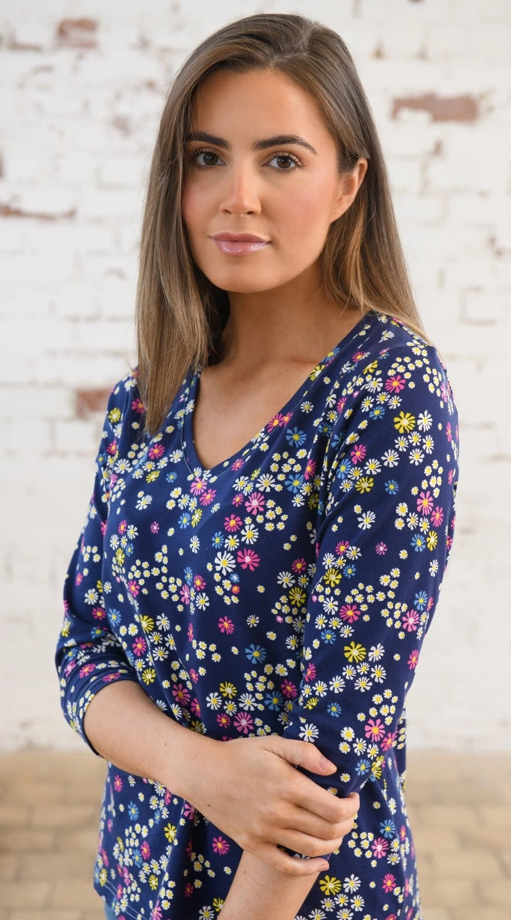 Women's Lighthouse Ariana v-neck t-shirt in navy with a multicoloured floral pattern.