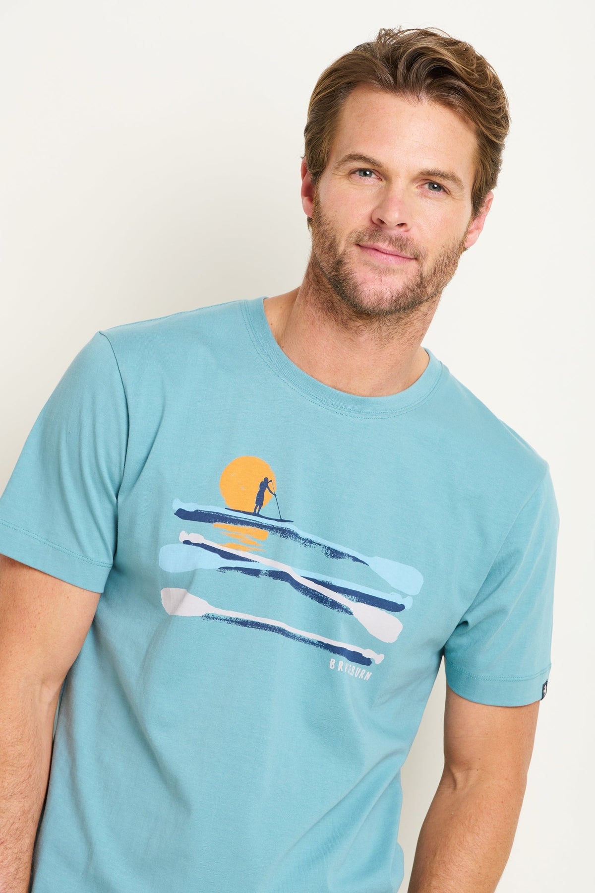 Mens Brakeburn paddleboard tee blue with paddleboard graphic and sunset design on front
