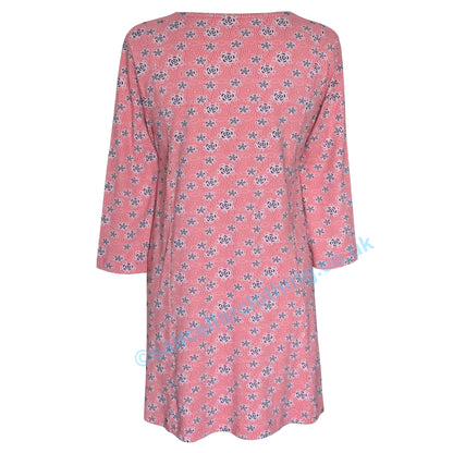 Back view of a Mudd and Water womens Francoise tunic in coral with a geo floral pattern and 3/4 length sleeves on a white background