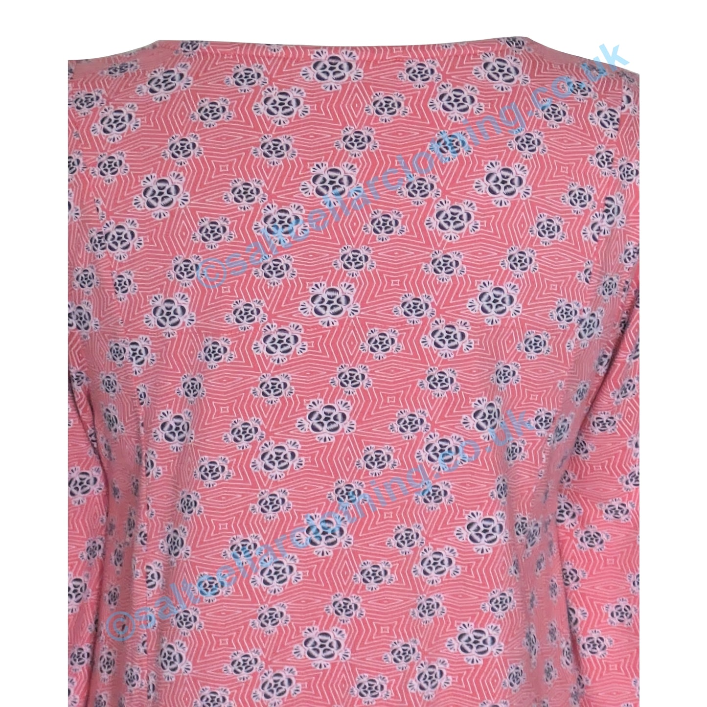 Back close-up view of a Mudd and Water womens Francoise tunic in Coral with a geo floral pattern on a white background