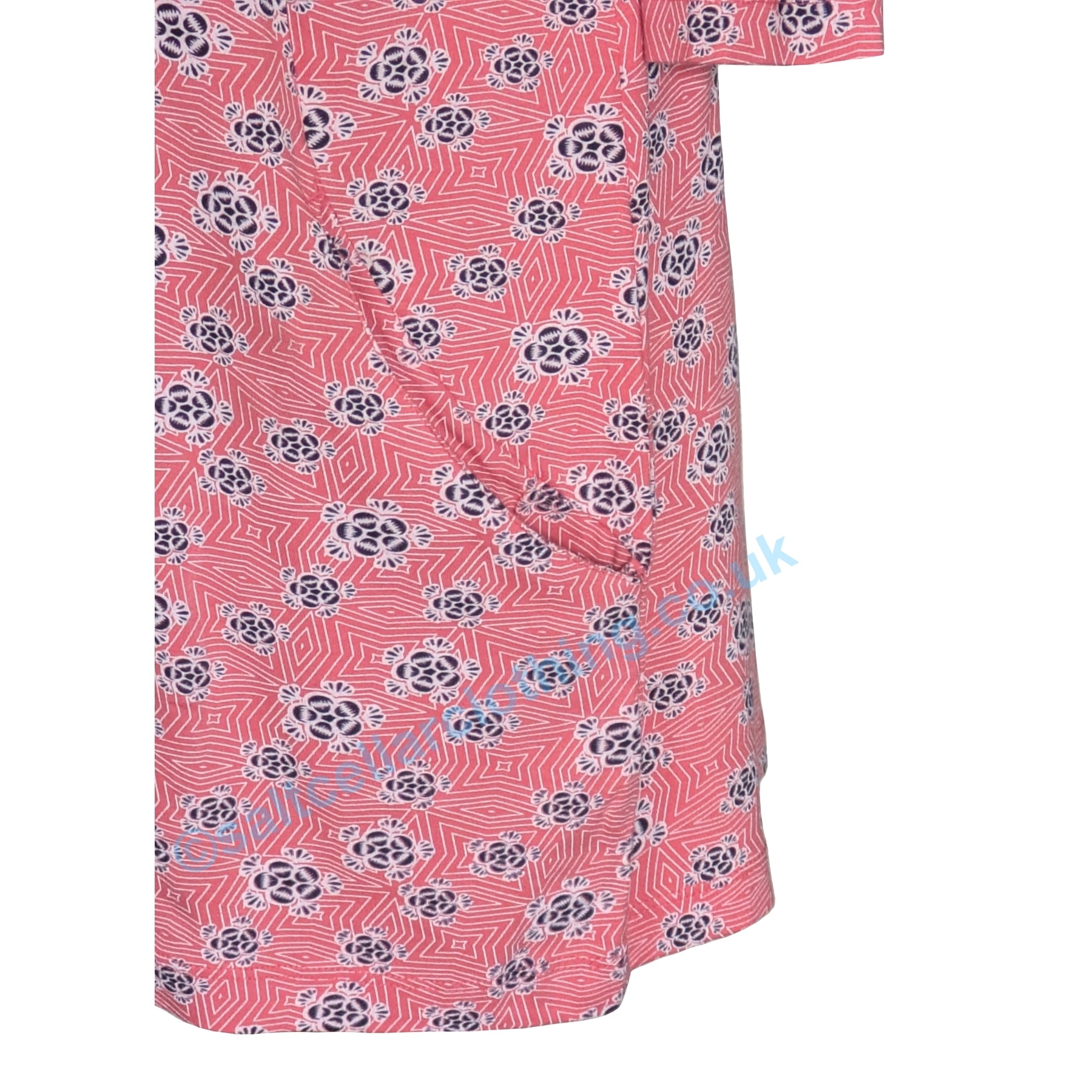 Closeup view of a Mudd and Water womens Francoise tunic in Coral with a Geo Floral pattern and a hip pocket on a white background