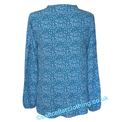 Back view of a womens Mudd & Water long sleeve Bailey Blouse in teal blue with a white abstract pattern, on a white background