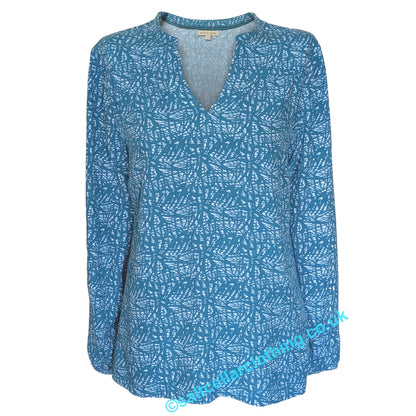 Front view of a Mudd & Water womens long sleeve Bailey louse in teal blue with a white abstract print and mandarin v-neckline, on a white background
