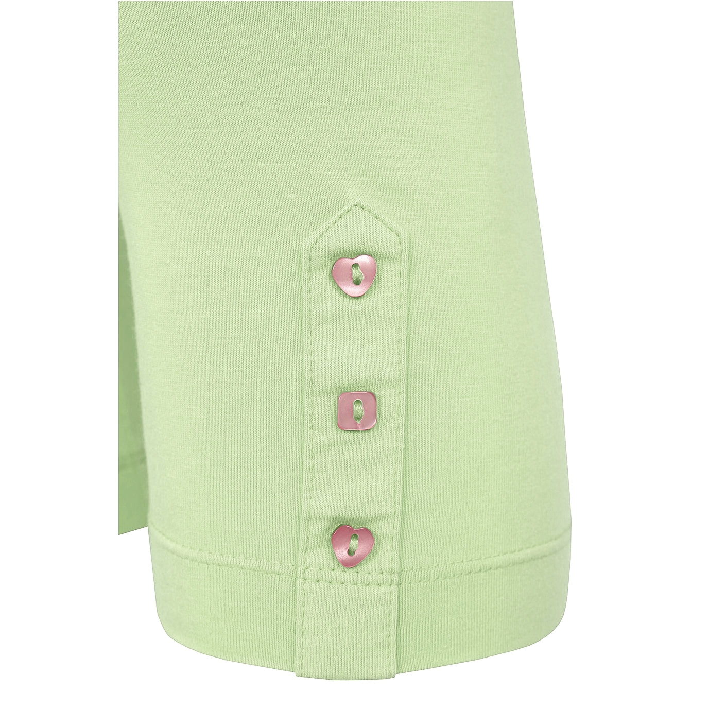 Close-up of Mudd and Water light green leggings with buttons on a white background