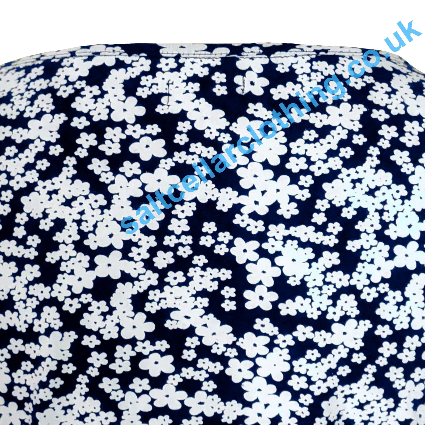 Close up of a Mudd & Water Kendal top navy blue fabric with a white floral pattern
