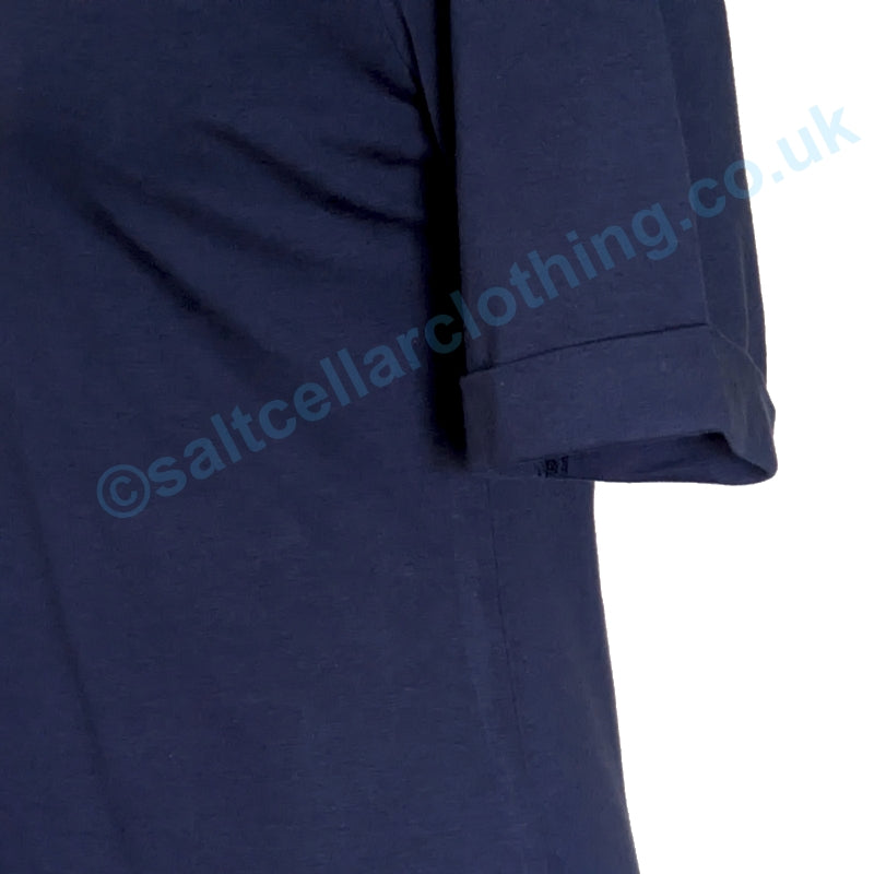 Close up view of a turn up sleeve of a plain Navy womens Mudd & Water Kendal top on a white background