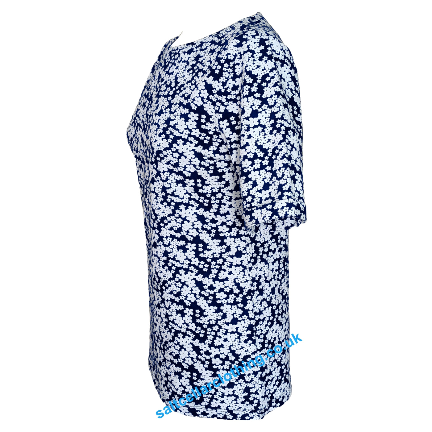 Side view of a womens short sleeve Mudd & Water Kendal top in navy with a white flower pattern on a white background