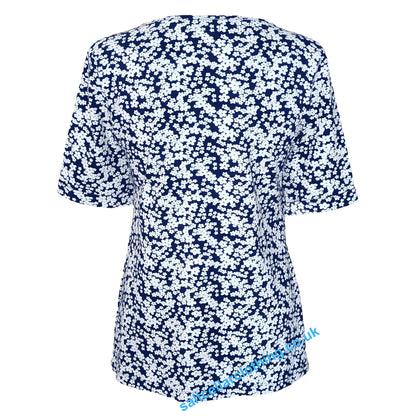 Baack view of a womens short sleeve Mudd & Water Kendal top in navy with a white flower print, on a white background