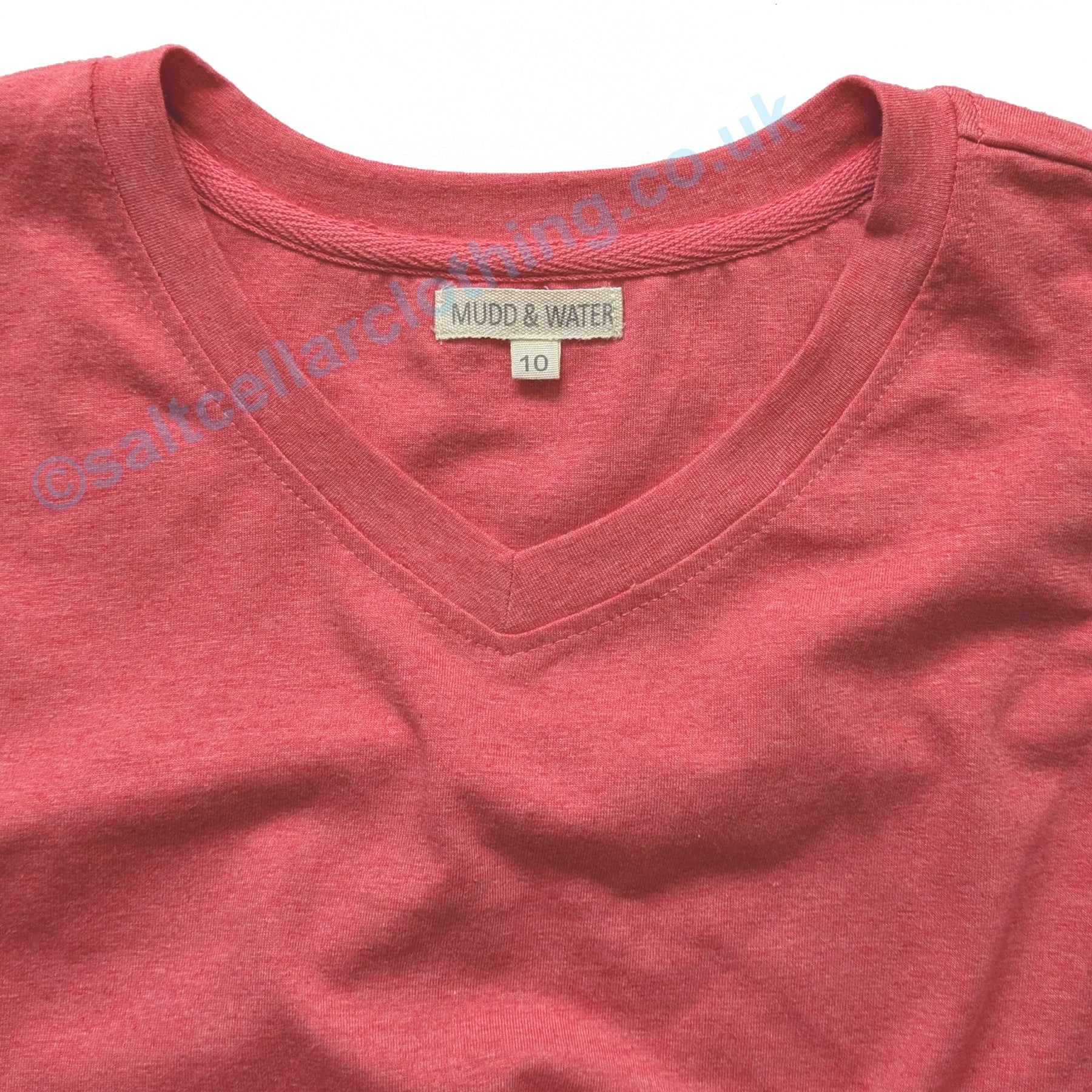 Close-up on the v-shape neckline of a womens Mudd and Water Meander Vest in coral marl.