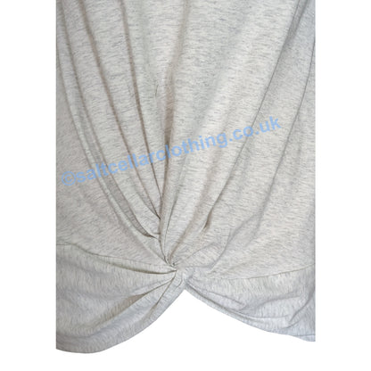 Close up of the twisted fabric front design of a Mudd & Water womens Petal tee in White Marl.