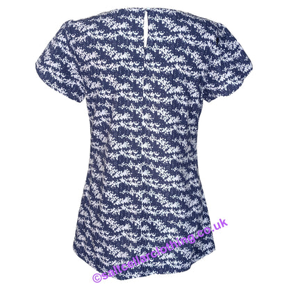 Back view of a womens Mudd & Water short sleeve Calla Top in navy with a white dot print