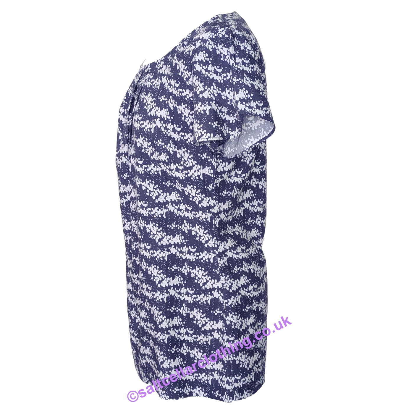 Side view of a womens short sleeve Mudd & Water Calla Top in navy with a white dot print and tulip sleeves on a white background