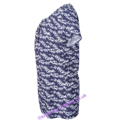 Side view of a womens short sleeve Mudd & Water Calla Top in navy with a white dot print and tulip sleeves on a white background