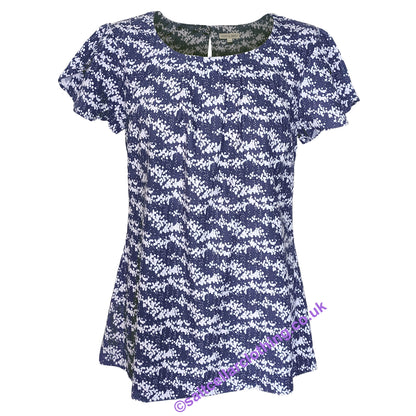 Front view of a Mudd & Water womens short sleeve Calla top in navy with a white dot pattern on a white background.