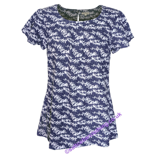 Front view of a Mudd & Water womens short sleeve Calla top in navy with a white dot pattern on a white background.