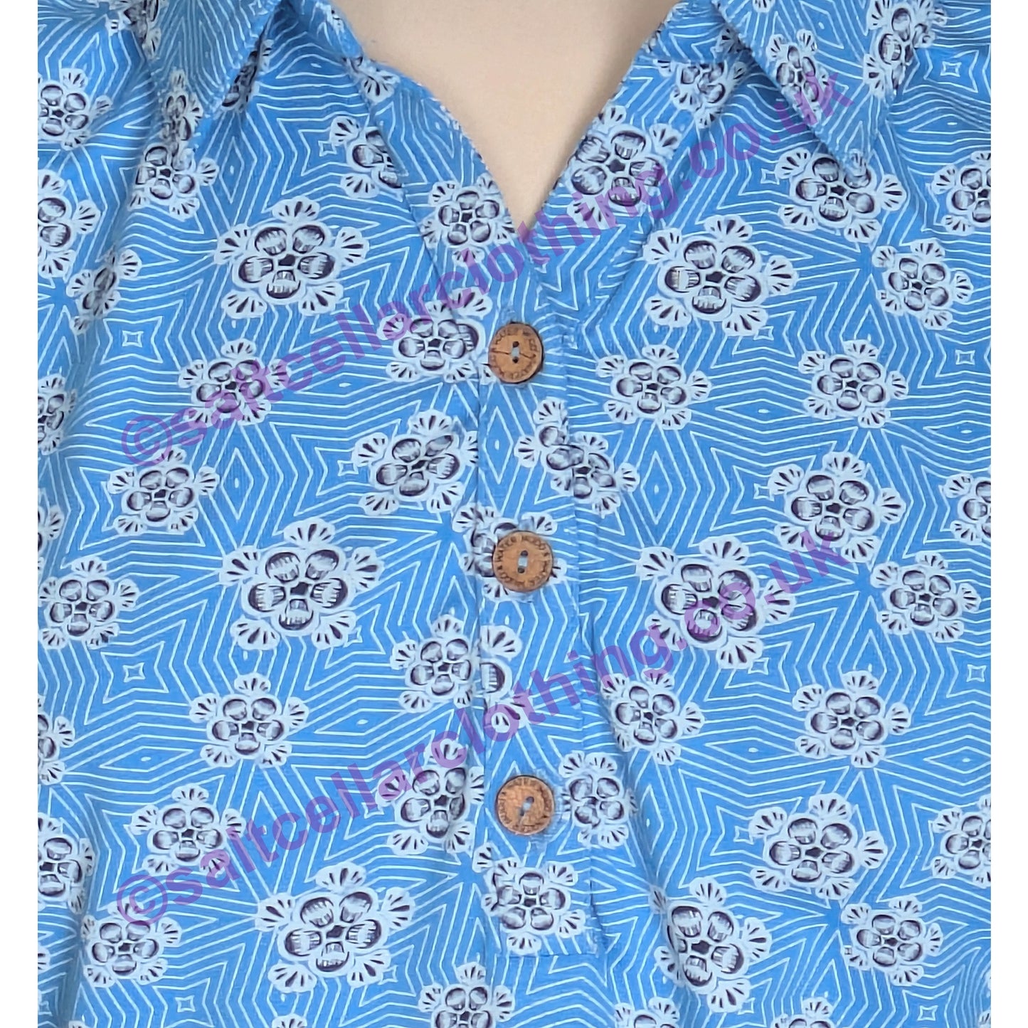Close-up on a Mudd & Water womens Alice top button neckline in Blithe Blue with a geo floral pattern