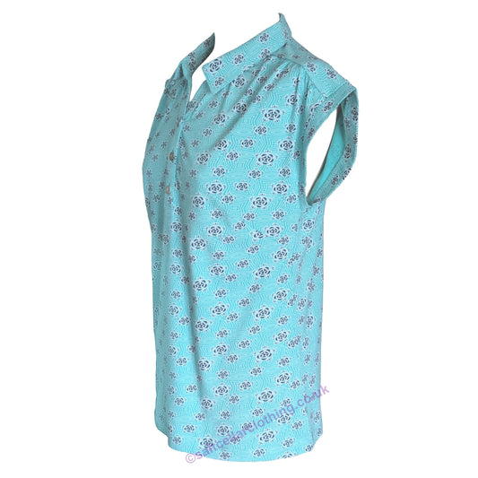 Side view of a womens Mudd & Water Alice Top in Ceramic Turquoise with a geo floral pattern on a white background