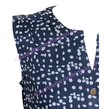 Close-up of a womens Mudd & Water navy blue sleeveless top with white polka dot pattern on a white background