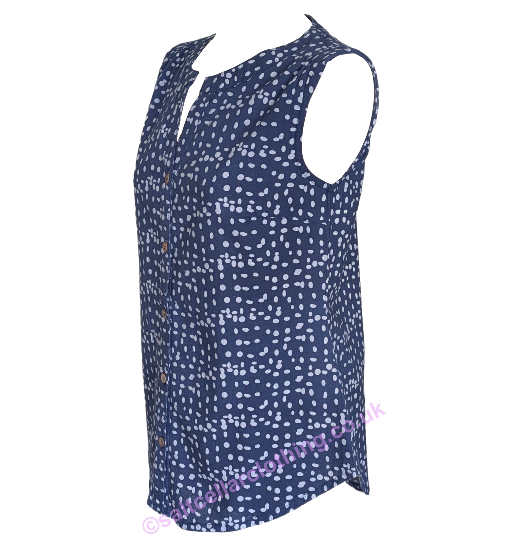 Side view of a womens Mudd & Water sleeveless Sunrise Blouse in navy with a white dot pattern and buttons down the front on a white background