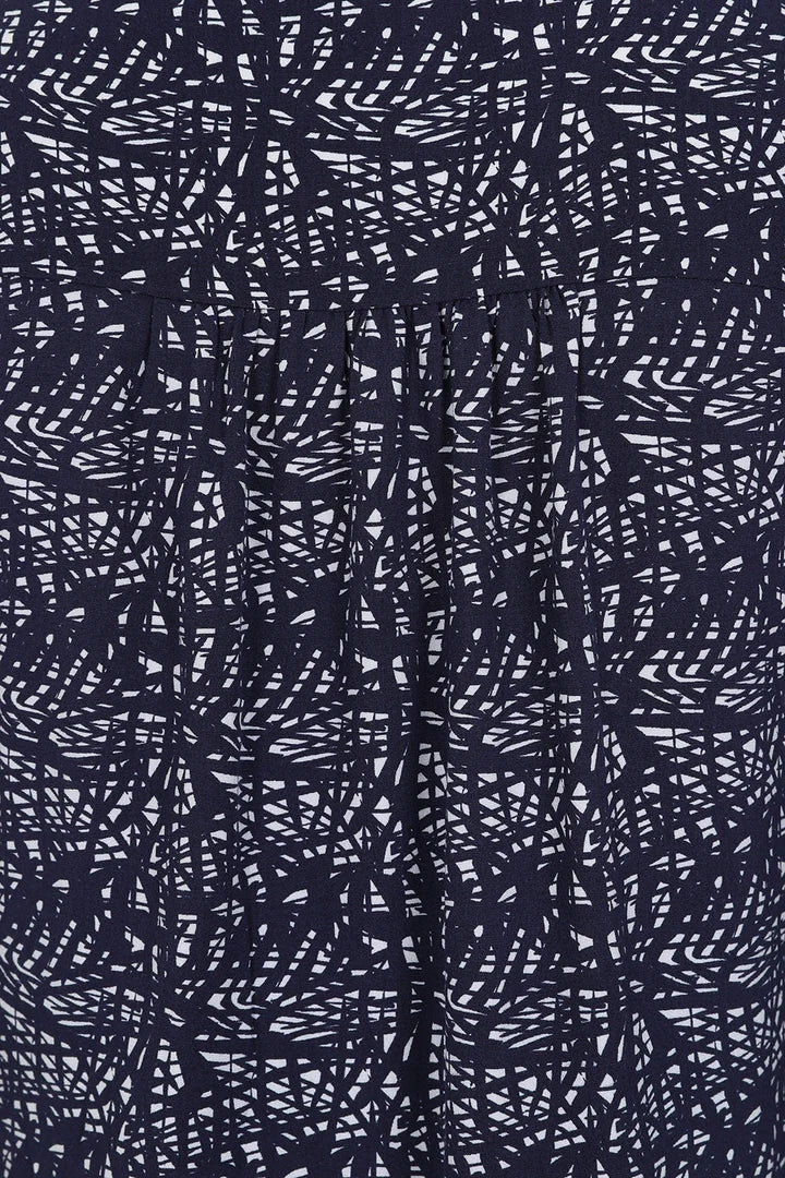 Close-up of Mudd and Water womens tunic navy with abstract white and navy pattern fabric