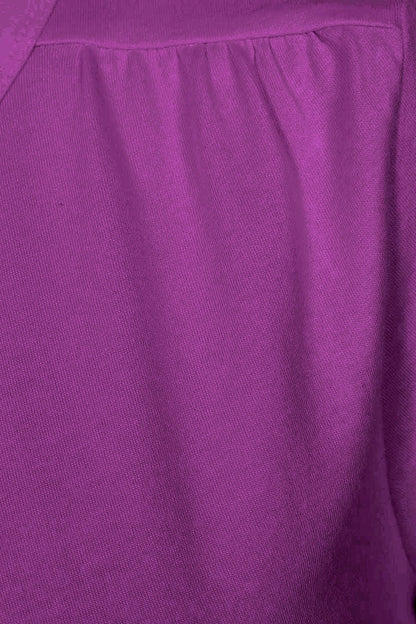 Close-up of gathered fabric on the shoulder of a womens Muddd & Water 'Aqua' t-shirt in Aster Purple