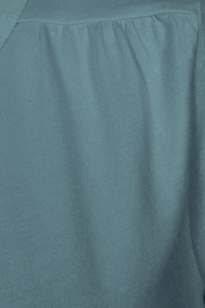 Close-up of gathered fabric on the shoulder of a womens Mudd & Water 'Aqua' tee in Teal.
