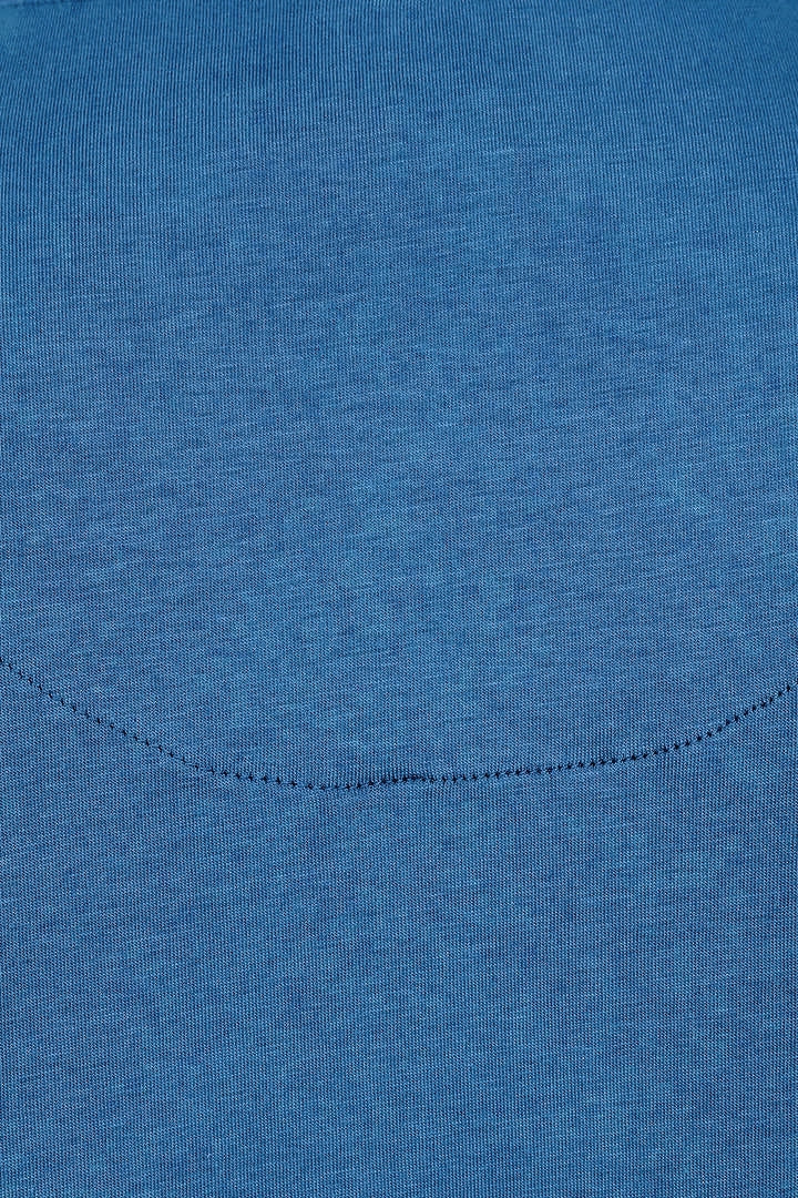 Close-up of a womens Mudd & Water Essential Top in a teal blue organic cotton fabric texture.