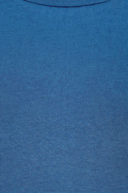 Close-up of a Mudd & Water womens organic cotton Essential Top in a Teal blue fabric texture