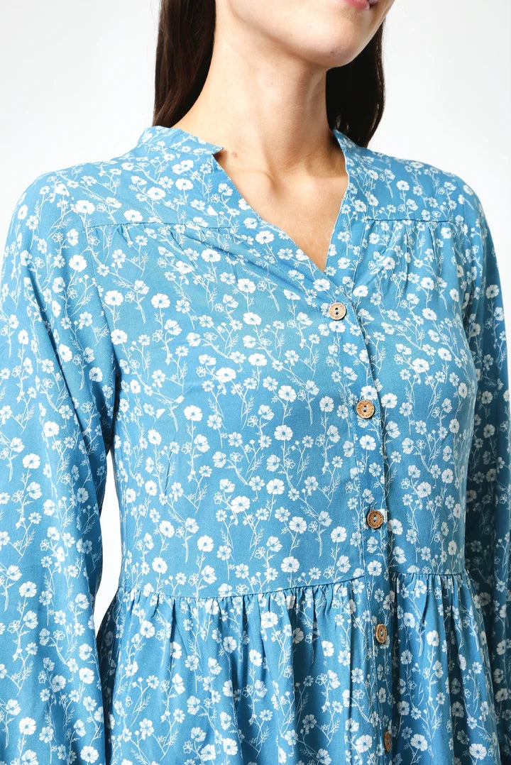 Mudd & Water women's Cellini Tunic in Teal Blue with a white meadow floral print, mandarin neckline and coconut buttons down the front.