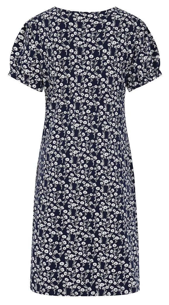 Women's short sleeve dress from Mudd & Water in Navy with a white meadow floral print with a v-neckline and gathered sleeve cuffs.