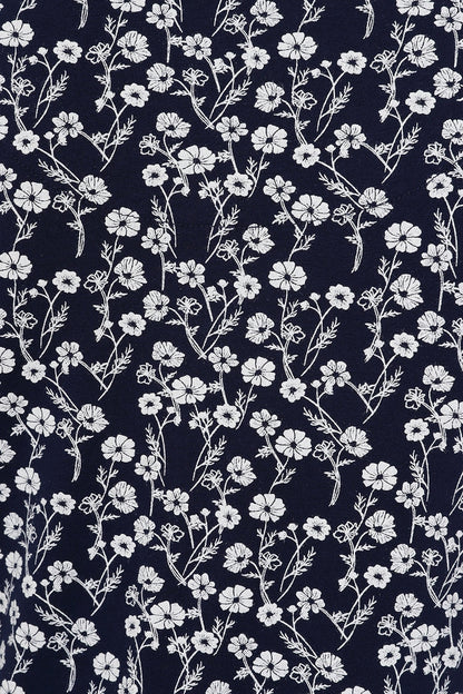 Women's Navy Florina short sleeve dress in navy with a white meadow floral pattern.