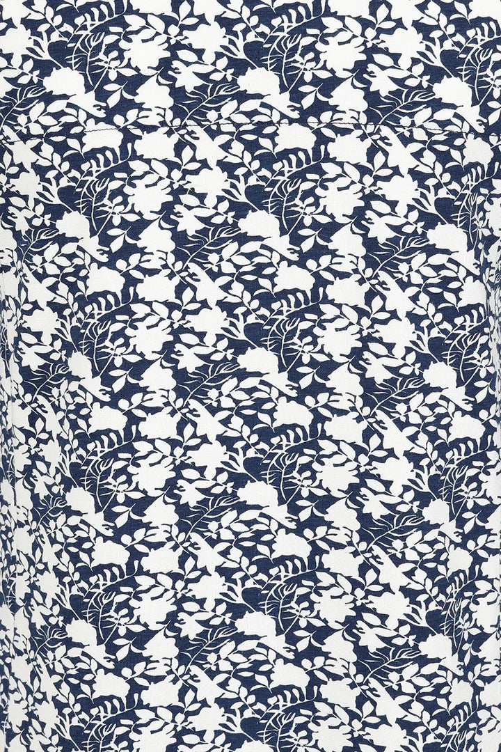 Three quarter sleeve women's tunic top from Mudd and Water in a navy and white floral print.