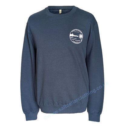 A Petrol blue unisex crewneck sweatshirt shown from the front, featuring a small white circular graphic print that reads 'PORTHLEVEN Salt Cellar CORNWALL' with a harbourside clocktower, palm tree, and waves.