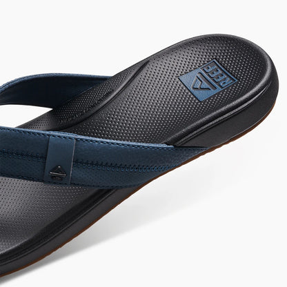 Reef Mens Cushion Phantom Flip Flops with durable straps and cushioned footbed for comfort
