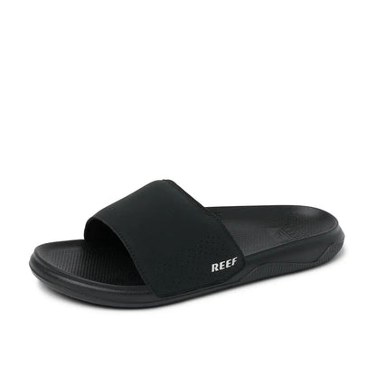 Side view of a mens Reef Tailslide slider sandal in black with a padded strap and molded sole
