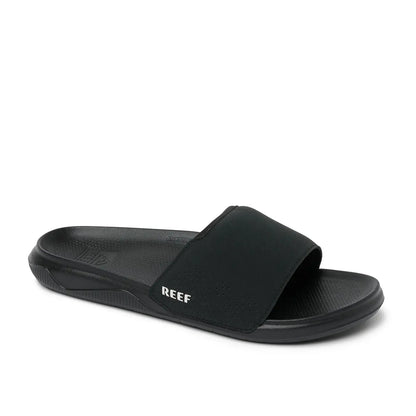 Main front view of a mens Reef Tailslide slider sandal in black with a padded strap.