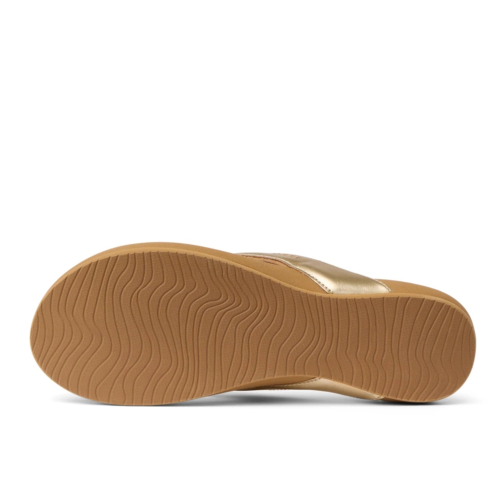Bottom sole view of women's Reef Cushion Melody flip flops with a Champage Gold strap and wave shape outsole grips.