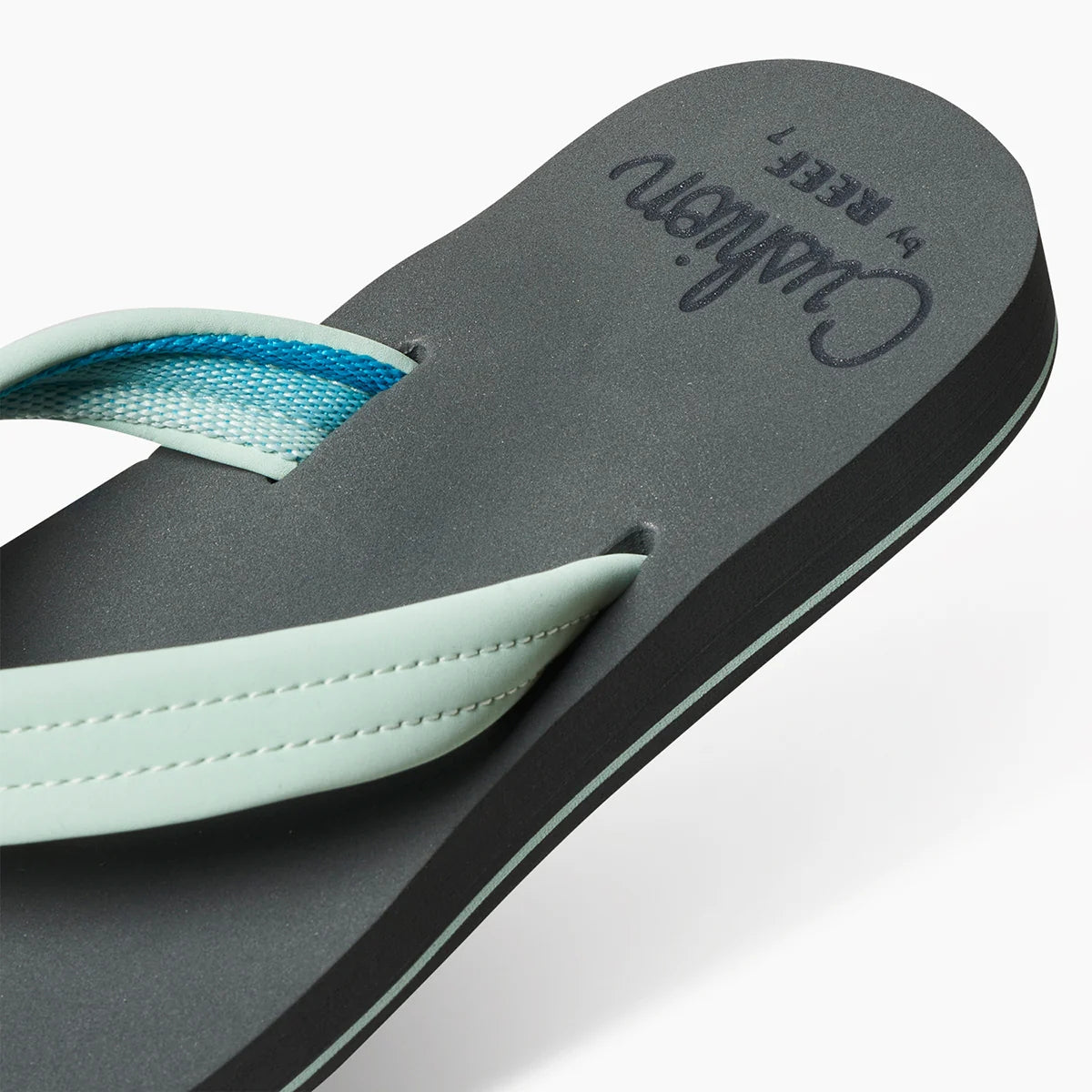 Reef womens Cushion Breeze flip flops with cushioned sole and light blue straps