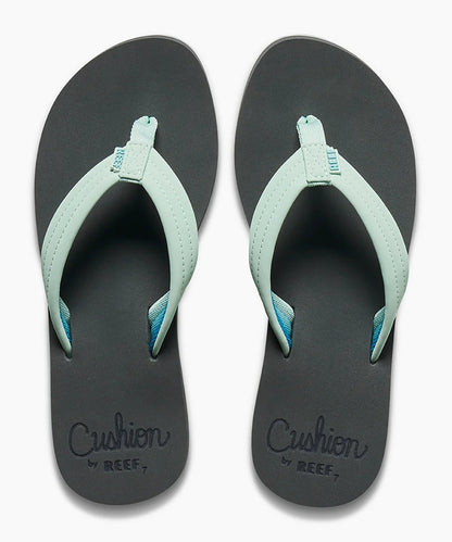 Reef womens Cushion Breeze flip flops in black with light blue straps and cushioned footbed for comfort